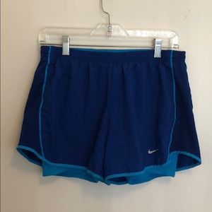 Blue Nike shorts with built in compression shorts